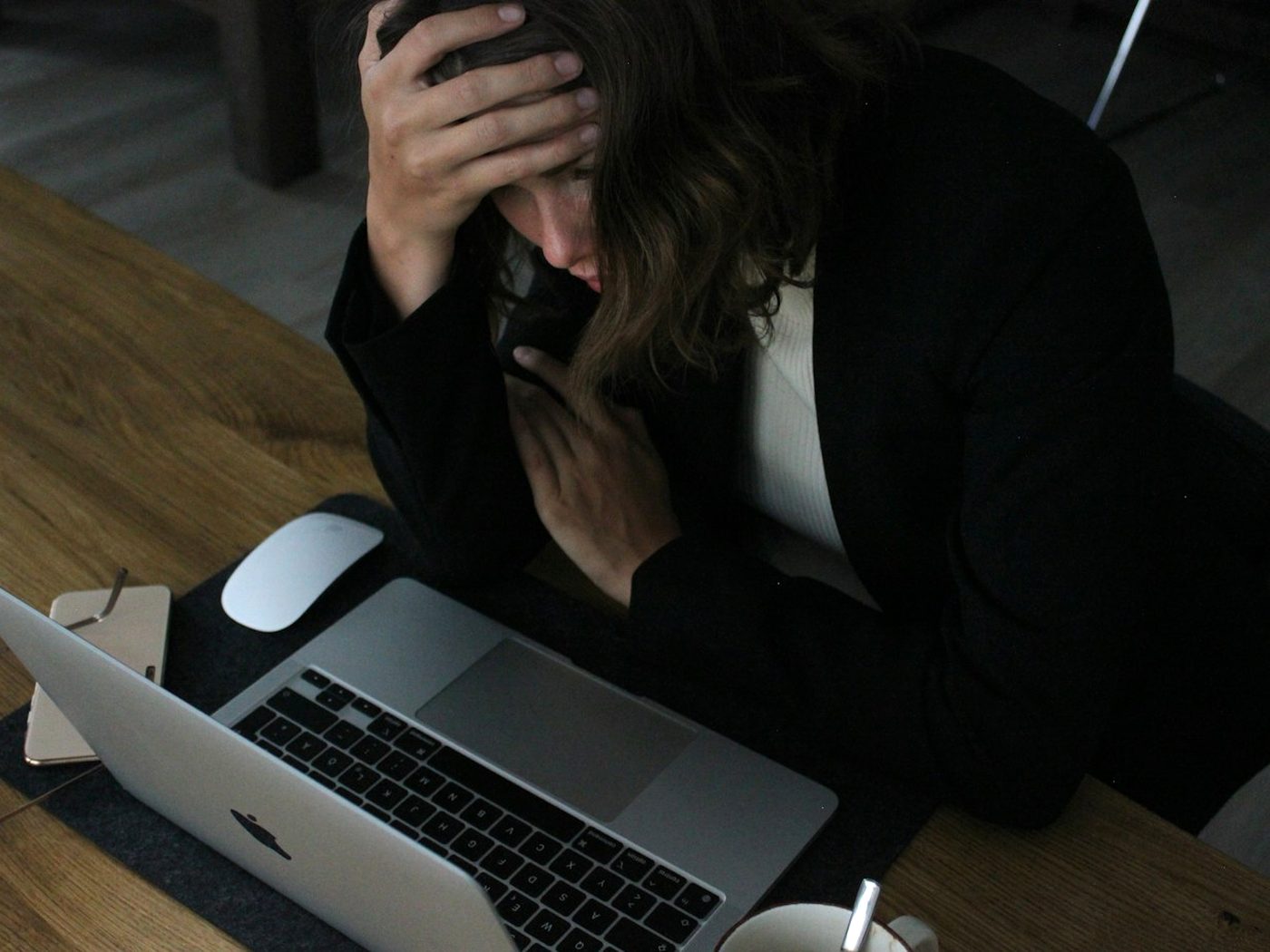 An agency owner working alone at a desk after hours